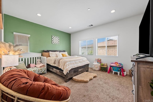 carpeted bedroom featuring recessed lighting, baseboards, and visible vents