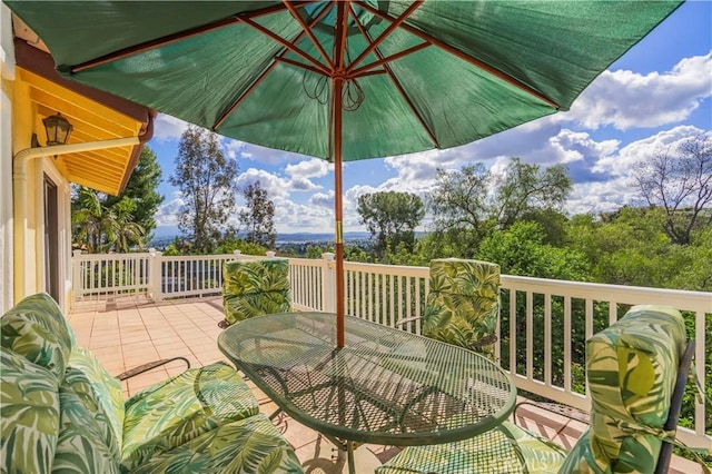 wooden deck featuring outdoor dining area