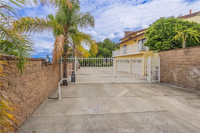 view of gate with fence