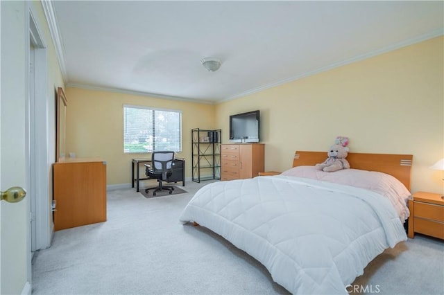 carpeted bedroom with baseboards and ornamental molding