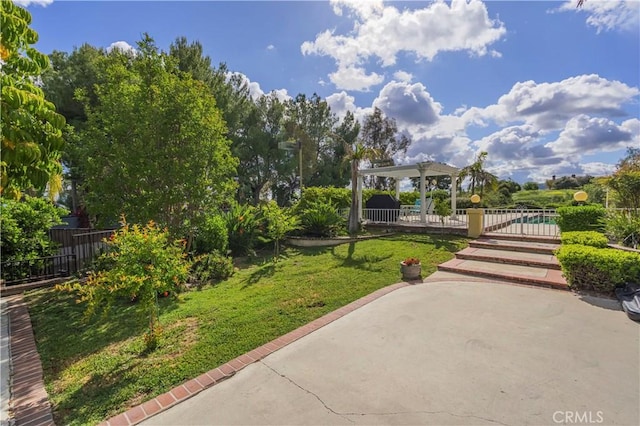 surrounding community featuring fence, a patio, a yard, and a pergola