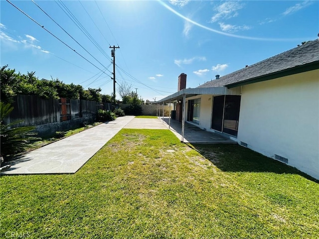 view of yard featuring a fenced backyard and a patio area