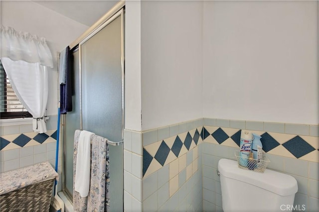 9706 Nan St, Pico Rivera, CA 90660 - full bath featuring tile walls, wainscoting, a stall shower, and toilet
