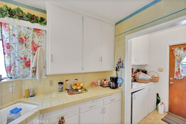 9706 Nan St, Pico Rivera, CA 90660 - kitchen with white cabinets and decorative backsplash