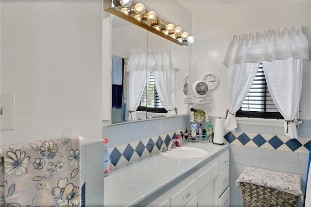 9706 Nan St, Pico Rivera, CA 90660 - bathroom with tile walls, vanity, and a wainscoted wall