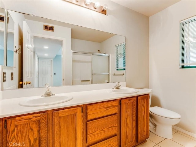 6405 Fiddleneck Ln, Avila Beach, CA 93424 - bathroom with a shower stall, double vanity, toilet, and tile patterned floors