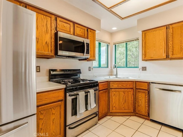 6405 Fiddleneck Ln, Avila Beach, CA 93424 - kitchen with stainless steel appliances, a sink, light countertops, brown cabinets, and recessed lighting