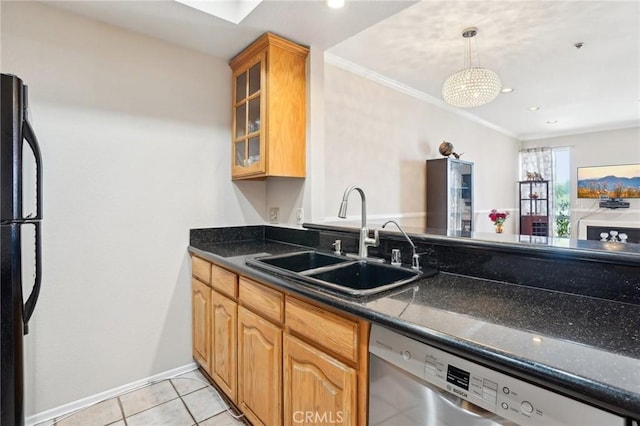 kitchen with crown molding, dark countertops, a sink, dishwasher, and freestanding refrigerator