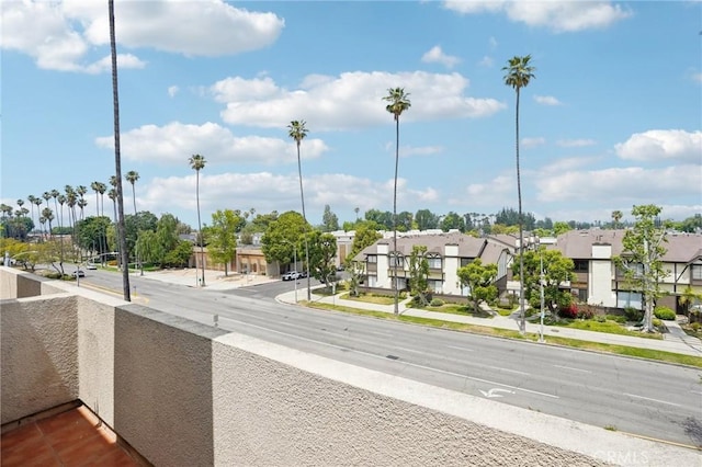 view of road with sidewalks and a residential view