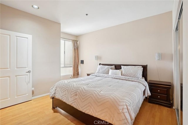 19350 Sherman Way Unit 335, Reseda, CA 91335 - bedroom with light wood-style floors, baseboards, and recessed lighting
