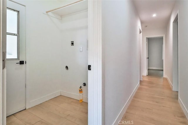 washroom featuring hookup for an electric dryer, laundry area, baseboards, light wood-style floors, and recessed lighting