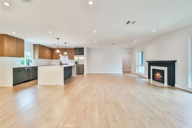 kitchen featuring visible vents, appliances with stainless steel finishes, modern cabinets, light countertops, and recessed lighting