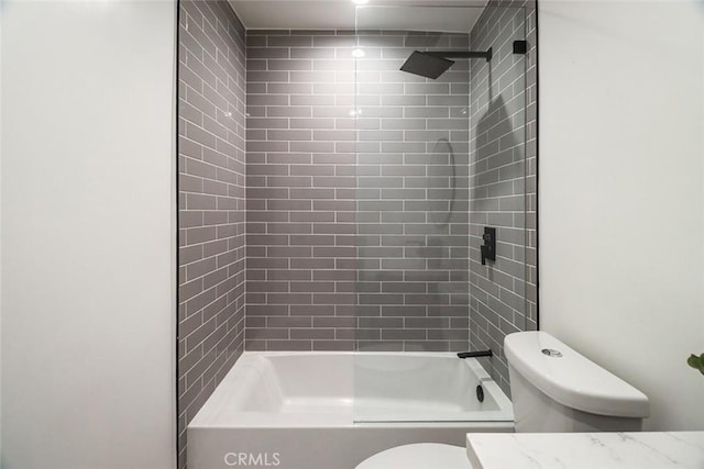 bathroom with shower / bathtub combination, toilet, and vanity