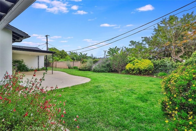 view of yard with a patio and fence