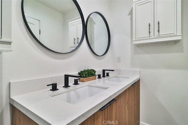 bathroom with double vanity and a sink