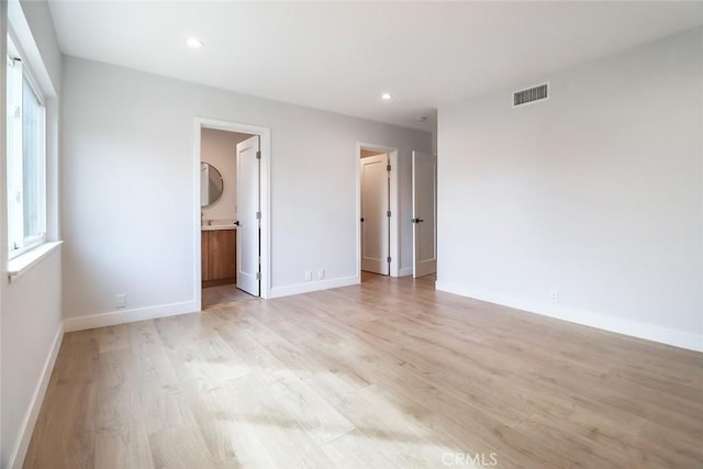 unfurnished bedroom with visible vents, recessed lighting, light wood finished floors, and baseboards