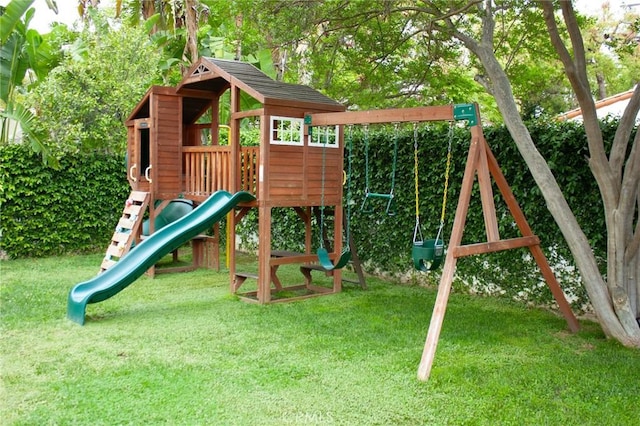 view of playground with a lawn