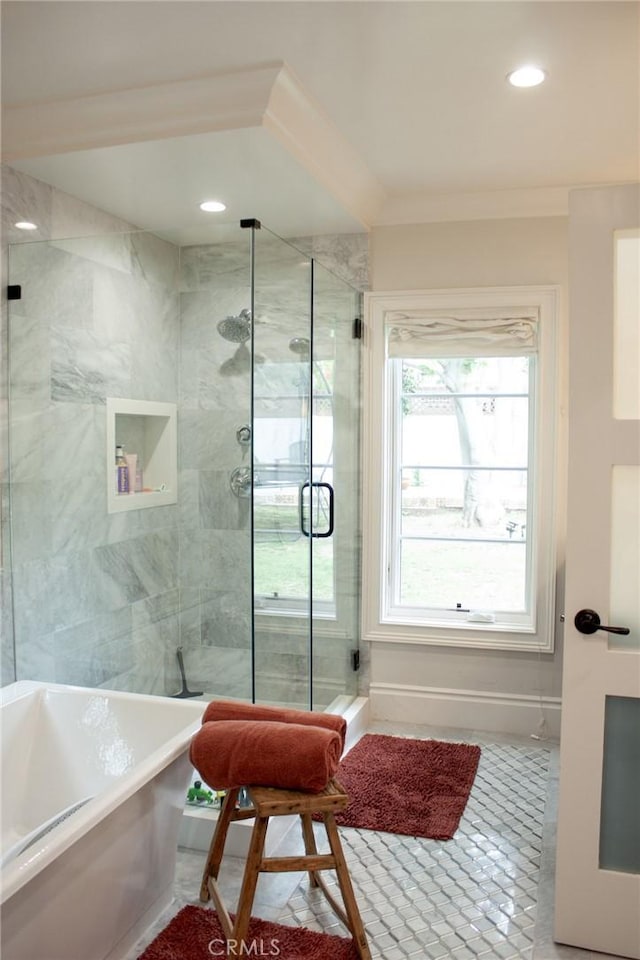 bathroom with tile patterned flooring, recessed lighting, a freestanding tub, and a shower stall
