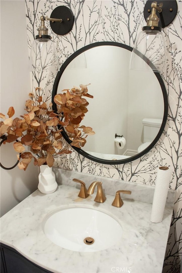 bathroom with vanity and toilet