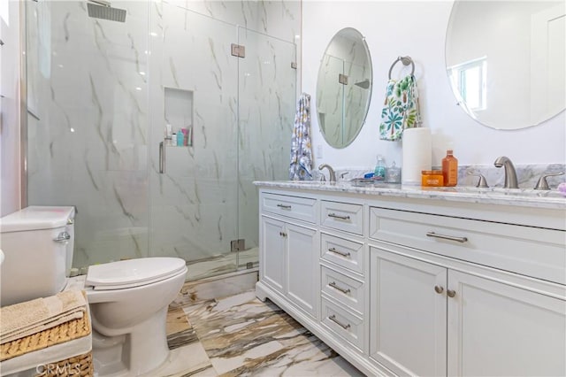 full bathroom featuring a sink, double vanity, toilet, a marble finish shower, and marble finish floor