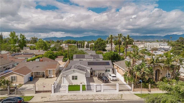 birds eye view of property featuring a mountain view and a residential view