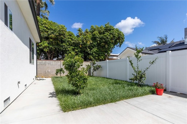 view of yard featuring a patio and a fenced backyard