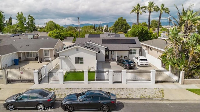 drone / aerial view featuring a residential view and a mountain view