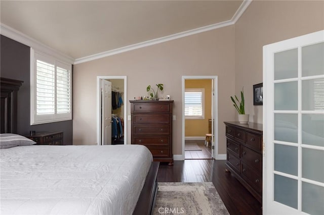 11080 Kayjay St, Riverside, CA 92503 - bedroom featuring a spacious closet, vaulted ceiling, dark wood finished floors, ornamental molding, and a closet