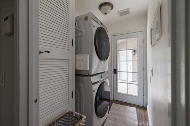 11080 Kayjay St, Riverside, CA 92503 - washroom with stacked washer / dryer and wood finished floors