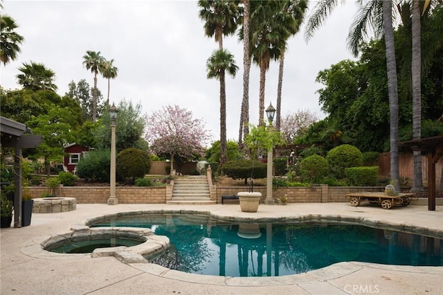 11080 Kayjay St, Riverside, CA 92503 - view of swimming pool with a patio area, stairs, and a pool with connected hot tub