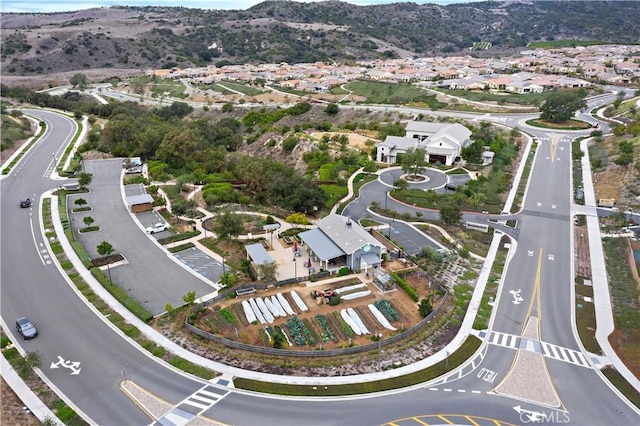 drone / aerial view featuring a mountain view and a residential view