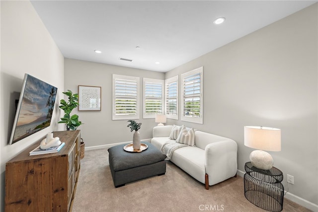 living area featuring baseboards, recessed lighting, carpet, and visible vents
