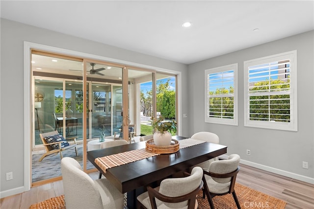 dining room featuring a ceiling fan, baseboards, recessed lighting, and light wood-style flooring
