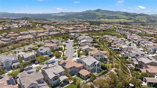 drone / aerial view with a residential view and a mountain view