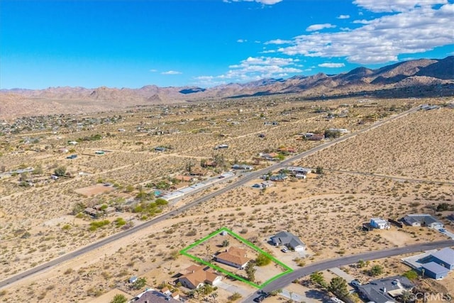 bird's eye view with a rural view, a mountain view, and view of desert