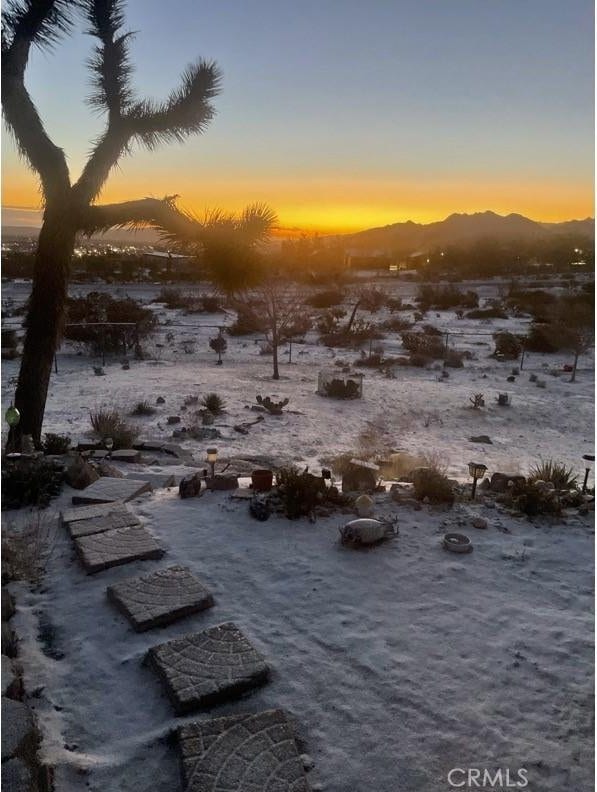 nature at dusk featuring a mountain view