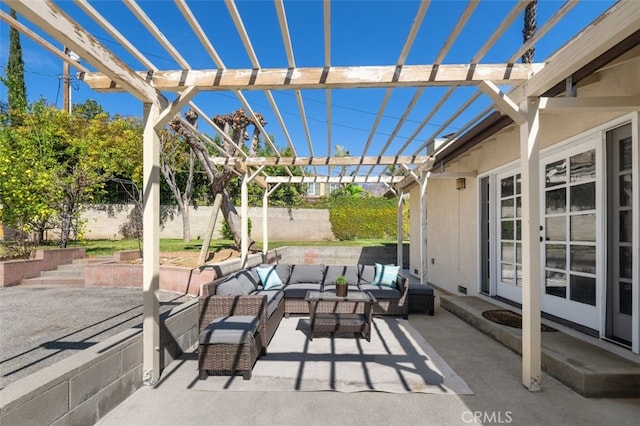 view of patio / terrace featuring a pergola, an outdoor living space, and fence