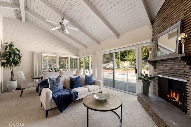 carpeted living area featuring a fireplace, high vaulted ceiling, beamed ceiling, and a ceiling fan