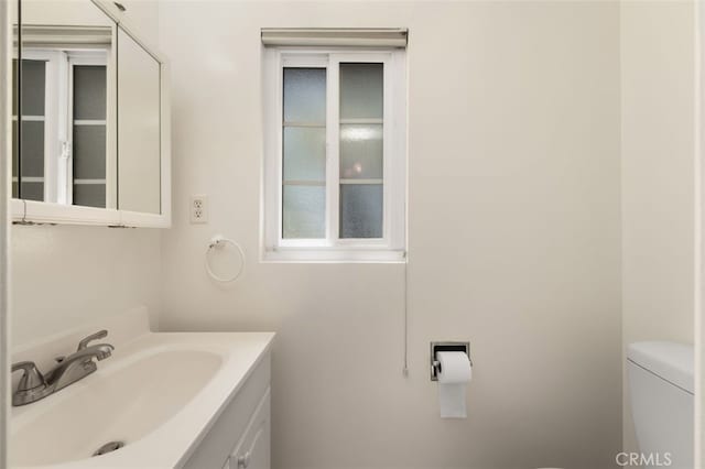 half bath with vanity and toilet