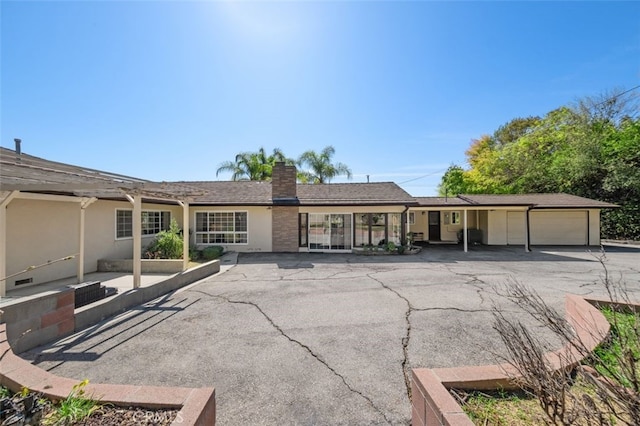 451 W Foothill Blvd, Arcadia, CA 91006 - back of property with a chimney, stucco siding, and a garage