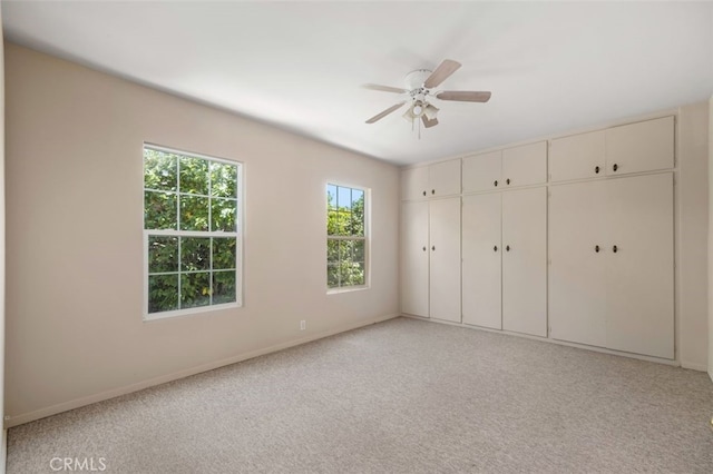 451 W Foothill Blvd, Arcadia, CA 91006 - unfurnished bedroom with baseboards, light carpet, and ceiling fan