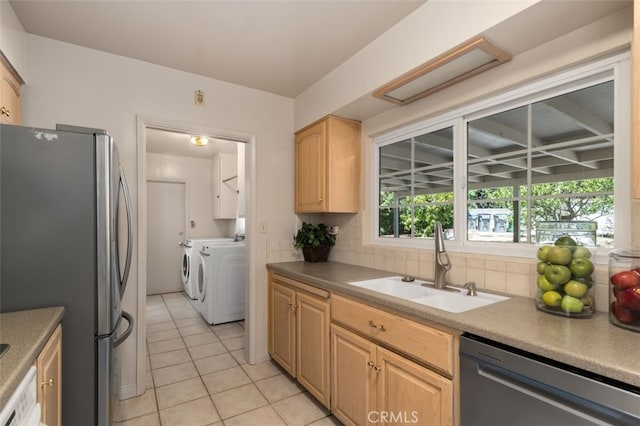 451 W Foothill Blvd, Arcadia, CA 91006 - kitchen with stainless steel appliances, washer and clothes dryer, a sink, light brown cabinetry, and light tile patterned flooring