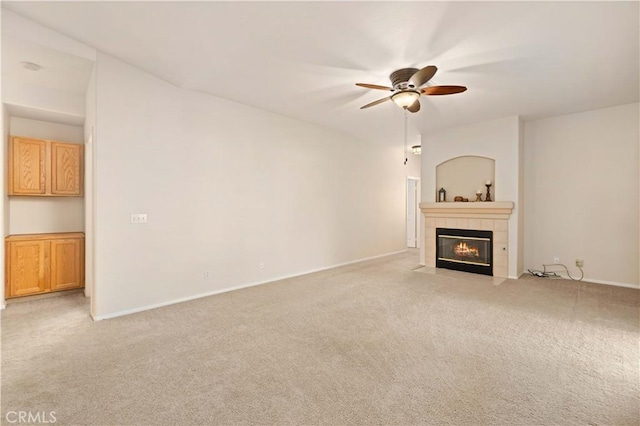 40949 Granite St, Palmdale, CA 93551 - unfurnished living room featuring a ceiling fan, baseboards, light colored carpet, and a fireplace