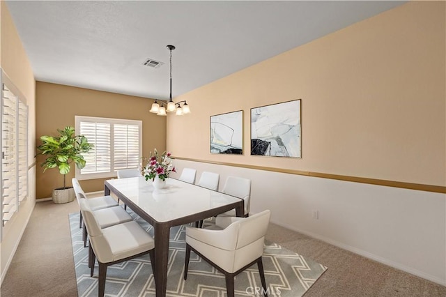 40949 Granite St, Palmdale, CA 93551 - carpeted dining space with baseboards, a chandelier, and visible vents
