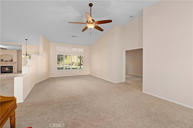 40949 Granite St, Palmdale, CA 93551 - unfurnished living room with a glass covered fireplace, baseboards, carpet, and a ceiling fan