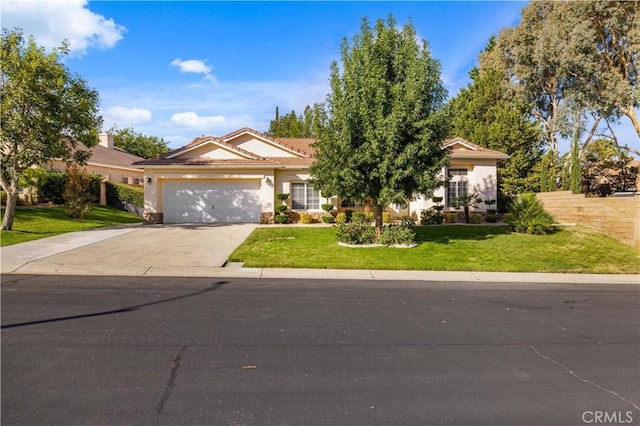 40949 Granite St, Palmdale, CA 93551 - view of front of property with an attached garage, driveway, and stucco siding