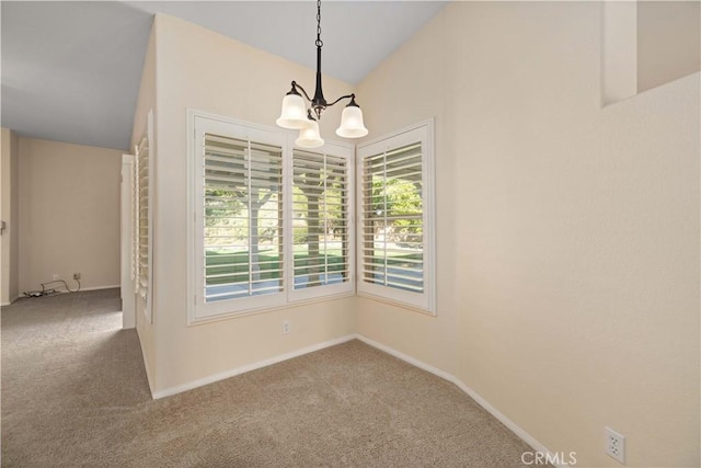 40949 Granite St, Palmdale, CA 93551 - unfurnished dining area with carpet floors, baseboards, a notable chandelier, and vaulted ceiling