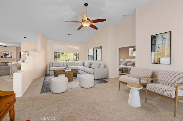 40949 Granite St, Palmdale, CA 93551 - carpeted living room with high vaulted ceiling, a ceiling fan, and visible vents