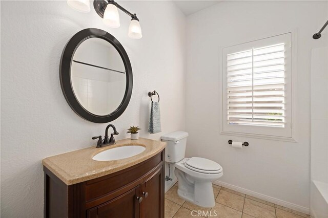 40949 Granite St, Palmdale, CA 93551 - bathroom featuring vanity, toilet, baseboards, shower / tub combination, and tile patterned floors