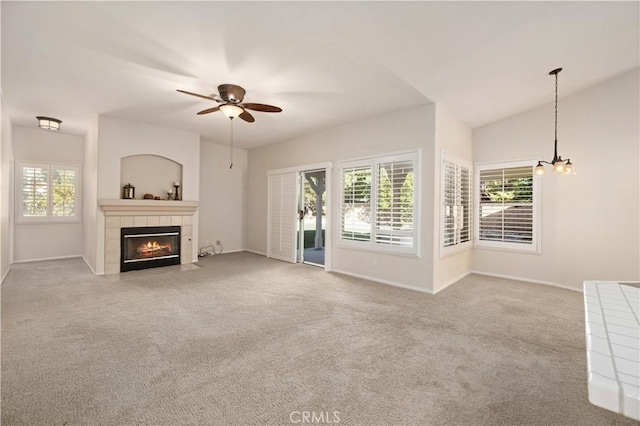 40949 Granite St, Palmdale, CA 93551 - unfurnished living room featuring a tiled fireplace, a ceiling fan, baseboards, and carpet flooring